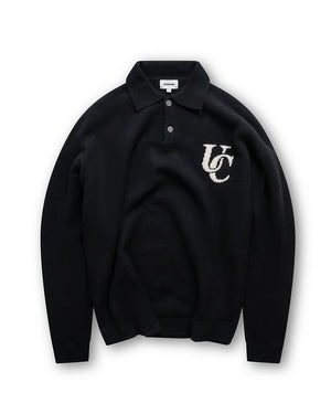Black sweater with 'UC' logo on a white background